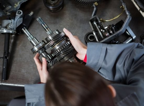 female-mechanic-holding-spare-parts_1170-1610